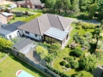 Außenansicht - Modern-Innovativ–Stilvoll. Gepflegter Bungalow mit großem Wintergarten. Ein Zuhause zum Wohlfühlen.