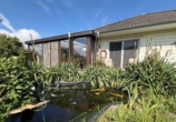 Garten - Modern-Innovativ–Stilvoll. Gepflegter Bungalow mit großem Wintergarten. Ein Zuhause zum Wohlfühlen.